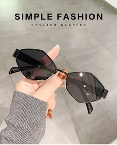 Close-up of black geometric hexagonal metal sunglasses for a stylish daily look