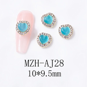 Close-up of blue cat eye heart nail charm with white rhinestones and 10x9.5mm size