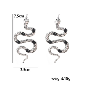 Macro view showing 7.5cm gothic snake drop earrings with black stones and size dimensions