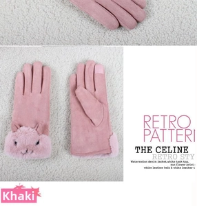 Close-up of pink suede gloves with plush rabbit trim and touch screen fingertips