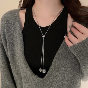 Silver stainless steel long necklace with solid and hollow filigree ball pendants