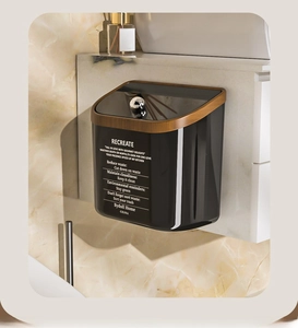 Detail of hanging kitchen bin with black body, wood grain frame and eco-friendly slogans