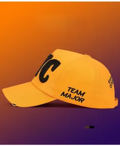 Detail of yellow baseball cap with black TEAM MAJOR embroidery and distressed brim