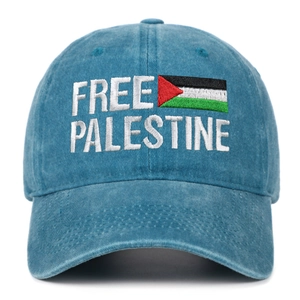 Detail of Free Palestine embroidery and national flag on blue washed denim baseball cap