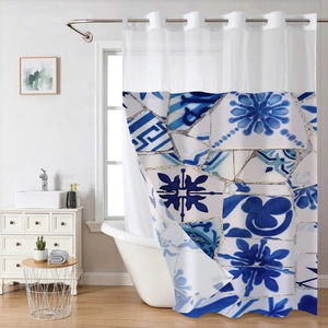 Detail of waffle weave shower curtain with blue mediterranean tiles and white mesh top