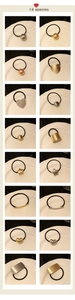 Macro view of geometric brushed metal alloy charms on high elastic black hair ties