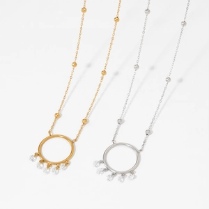 Elegant dreamcatcher necklace with silver and gold rings and dangling cubic zirconia stones