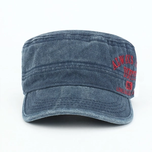 Detailed view of vintage washed blue cotton cadet cap with red embroidery and texture