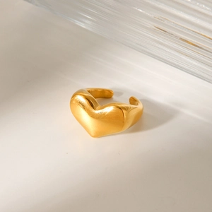 Polished golden heart-shaped open ring made of durable stainless steel on a white surface