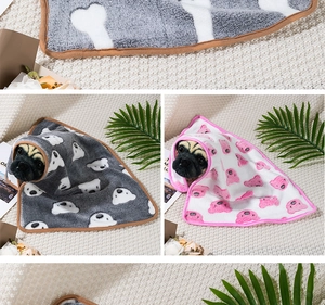 Close-up of soft flannel pet blankets featuring cute grey and pink bear pattern prints