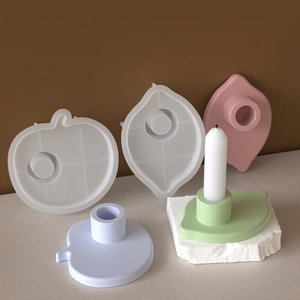 Detail of pumpkin and leaf silicone molds with colorful resin candle holders