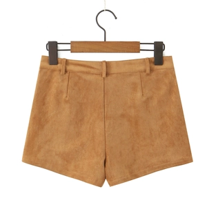 Close-up of brown faux suede shorts with high waist design and smooth texture