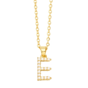 Detail of gold chain necklace with letter E pendant inlaid with small white pearls