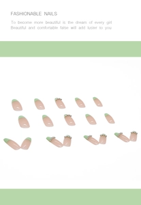Detail view of pink and green French press-on nails with silver bead chain accents