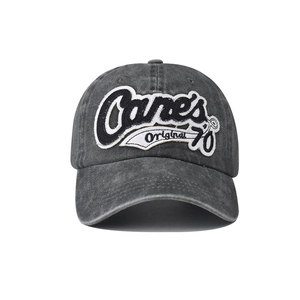 Close-up of vintage washed dark gray baseball cap with Canes Original 70 embroidery