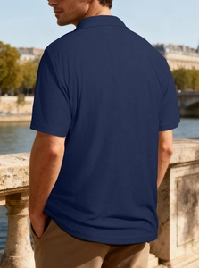 Close-up of navy blue knit polo shirt with waffle texture for men in outdoor setting