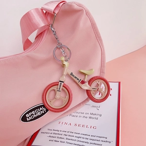Cute pink miniature bicycle keychain pendant for bags with a silver metal keyring