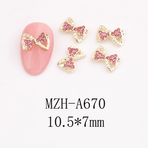 Pink rhinestone bow nail charms with gold metal base measuring 10.5x7mm for DIY manicure