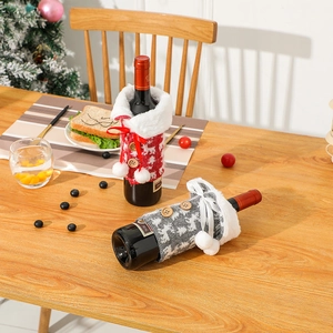 Knitted Christmas wine bottle covers with reindeer patterns and plush collars for holiday decor