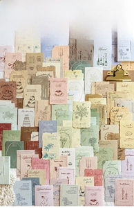 Detail of vintage scrapbooking paper set with floral motifs and aesthetic retro cards