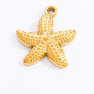 Macro shot of 18k gold starfish pendant detail with realistic textured metal surface
