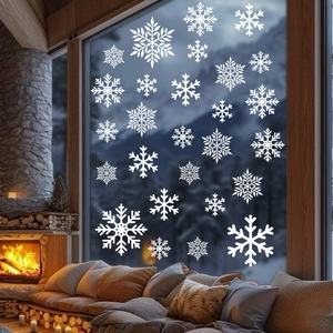 Detailed white snowflake window clings with festive warm fireplace background