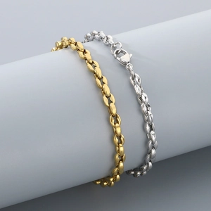 Detailed view of silver and gold stainless steel coffee bean link chain bracelets