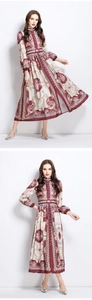 Detail of baroque floral pattern on royal style maxi dress with stand collar and buttons