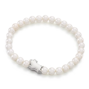 Minimalist pearl bracelet with gold-plated pig charm and round white beads on white background