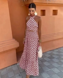 Detail of red and white geometric print maxi dress with cross neck and waist cut-out