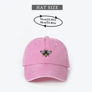 Size chart for washed pink baseball cap with bee embroidery showing 56-58cm head circumference