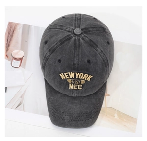 Detail of vintage washed cotton baseball cap with gold embroidery New York 1978