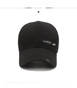 Close-up of black herringbone fabric baseball cap with silver metal side hardware detail