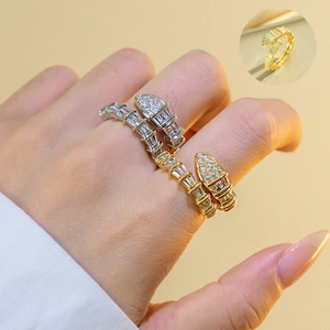 Detailed close-up of adjustable snake rings featuring gold finish and micro-set zirconia