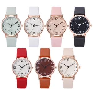 Detail showing seven colors of women's quartz watches with rose gold cases and leather straps