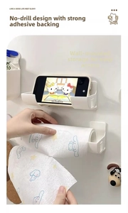 Macro view of white ABS wall-mounted storage rack with mobile phone and paper towel holders