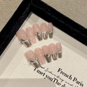 French Y2K press-on nails featuring silver metallic butterflies and pink jelly base