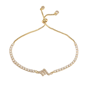 Detailed close-up of golden Scorpio zodiac bracelet with sparkling cubic zirconia inlay