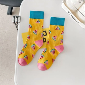 Vibrant yellow cotton socks with colorful watermelon patterns and blue ribbed cuffs