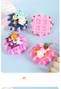 Detailed view of colorful PVC miniature cream waffle cake charms with cute berry accents