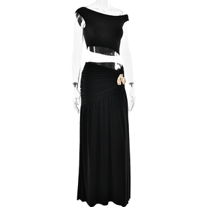 Detail of the golden leaf waist accessory on this black two-piece summer slim fit dress