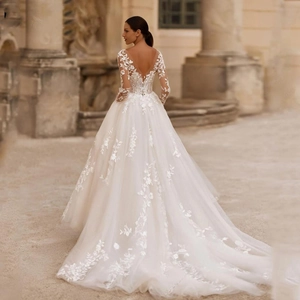 Elegant ivory A-line wedding dress featuring long lace sleeves and a long luxury train