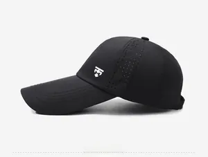 Detail of black long-brim baseball cap with laser-cut side vents for breathability