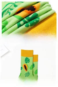 Detail of tropical papaya pattern socks showing premium combed cotton texture and elastic cuff