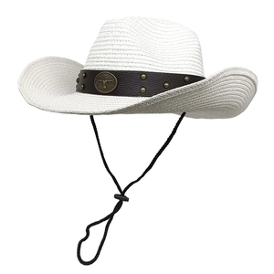 Detail of white straw cowboy hat with leather band, metallic bull logo and chin strap