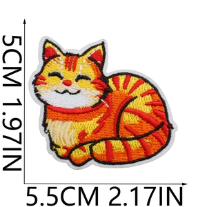 Detailed embroidery of yellow cat patch with exact dimensions of 5.5cm by 5cm