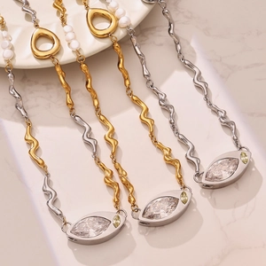 Gold and silver wavy chain necklace with freshwater pearls and marquise zircon pendant
