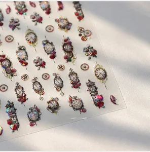 Macro detail of M-746 nail stickers featuring vintage clocks and red rose patterns