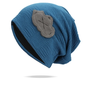 Blue knitted slouchy beanie featuring a cloud patch and wavy textured design for women