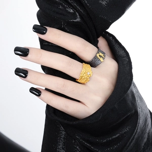 Minimalist wide textured open rings with zircon inlay shown on hands in a close-up view